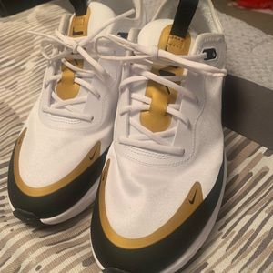 Barely worn Nike Tennis ..White with black & Gold print